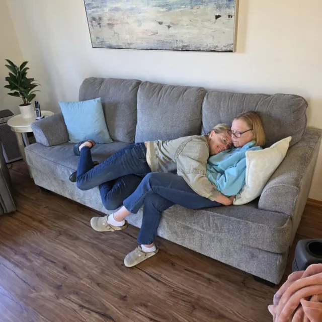Family visit on the living room sofa at AAA Shepherd’s Care Home
