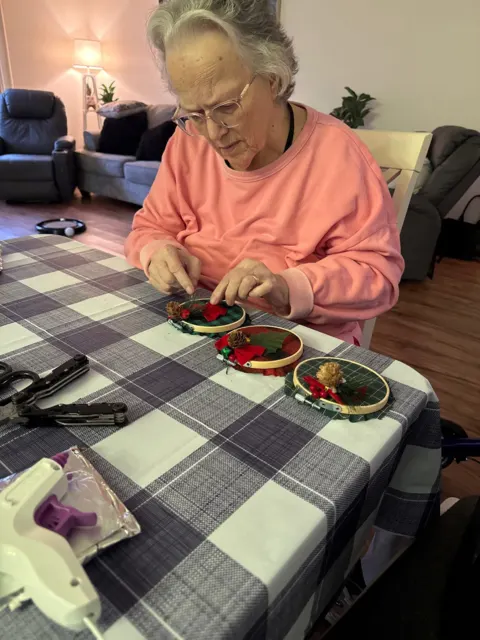 Resident enjoying a meal at a checkered table at AAA Shepherd’s Care Home