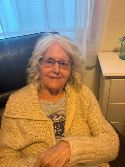 Resident relaxing in a comfortable armchair at AAA Shepherd’s Care Home