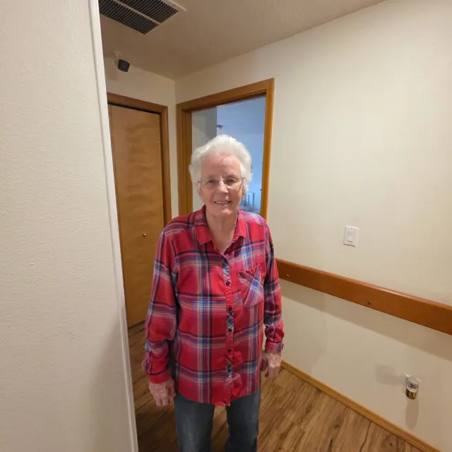 Resident standing in the hallway at AAA Shepherd’s Care Home