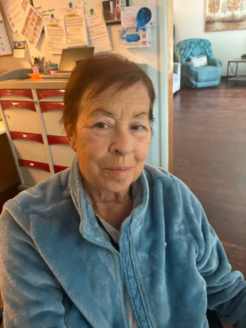 Resident wearing a blue fleece at AAA Shepherd’s Care Home