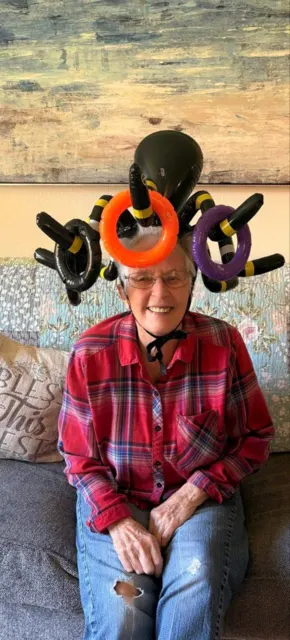 Resident wearing a festive Halloween hat at AAA Shepherd’s Care Home