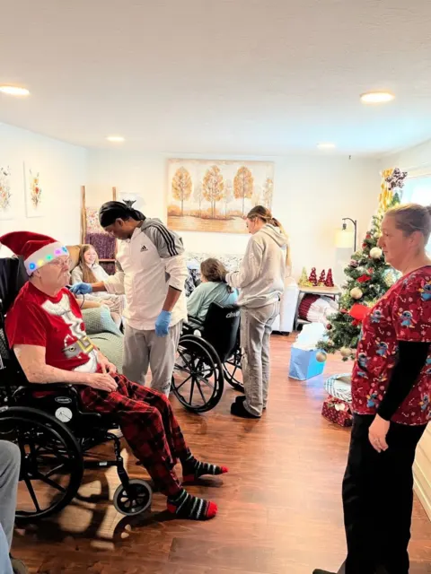 Residents and staff celebrating the holidays at AAA Shepherd’s Care Home