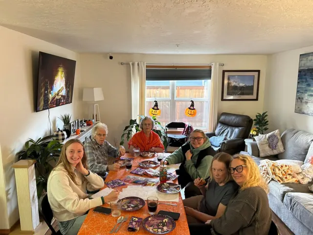 Residents and visitors sharing a holiday meal at AAA Shepherd’s Care Home