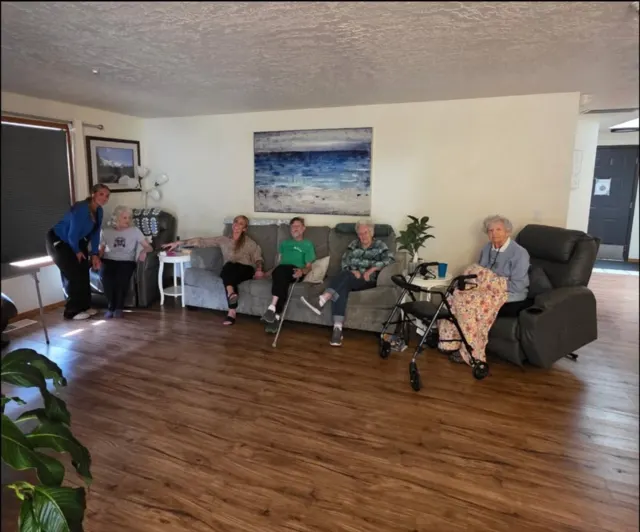 Residents gathering in the living room at AAA Shepherd’s Care Home