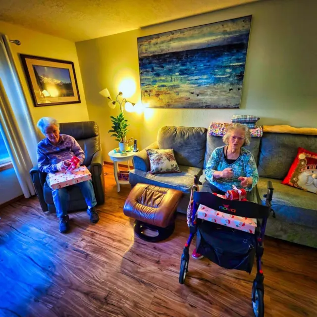 Residents relaxing in the bright living room at AAA Shepherd’s Care Home