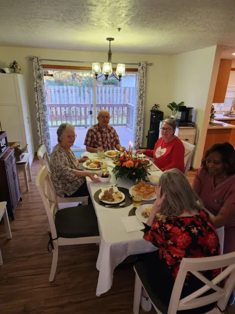 Residents sharing a meal in the dining room at AAA Shepherd’s Care Home