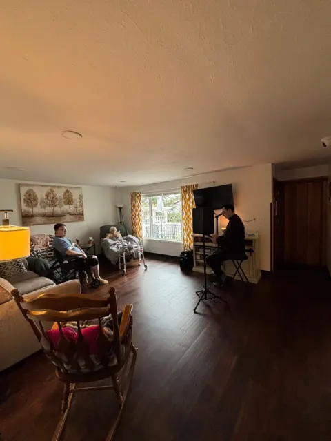 Shared living room with comfortable seating at AAA Shepherd’s Care Home
