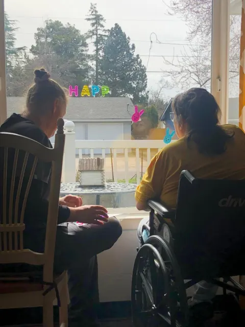 Sharing a meal beside a sunny window at AAA Shepherd’s Care Home